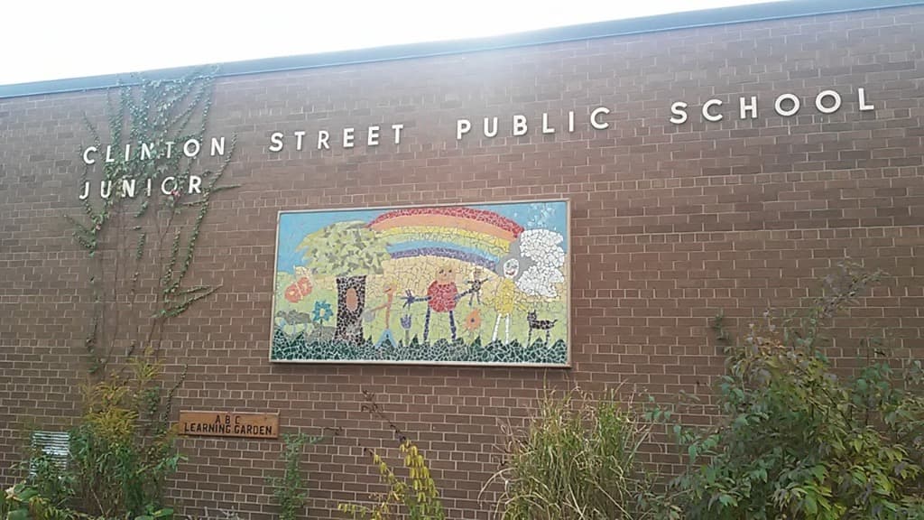 Modern Clinton Street Junior Public School with colorful rainbow mosaic mural adorning the brick facade