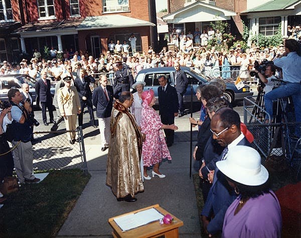 Outdoor ceremony with large crowd gathered for Queen Elizabeth The Queen Mother's visit to unveil Healey Willan plaque, July 3, 1989