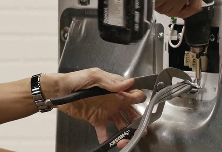 Removing old dryer cord with pliers