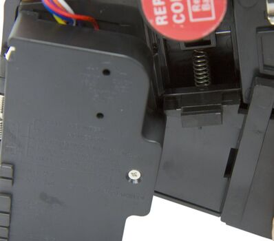 Coin divot insertion showing the small slot in coin holder