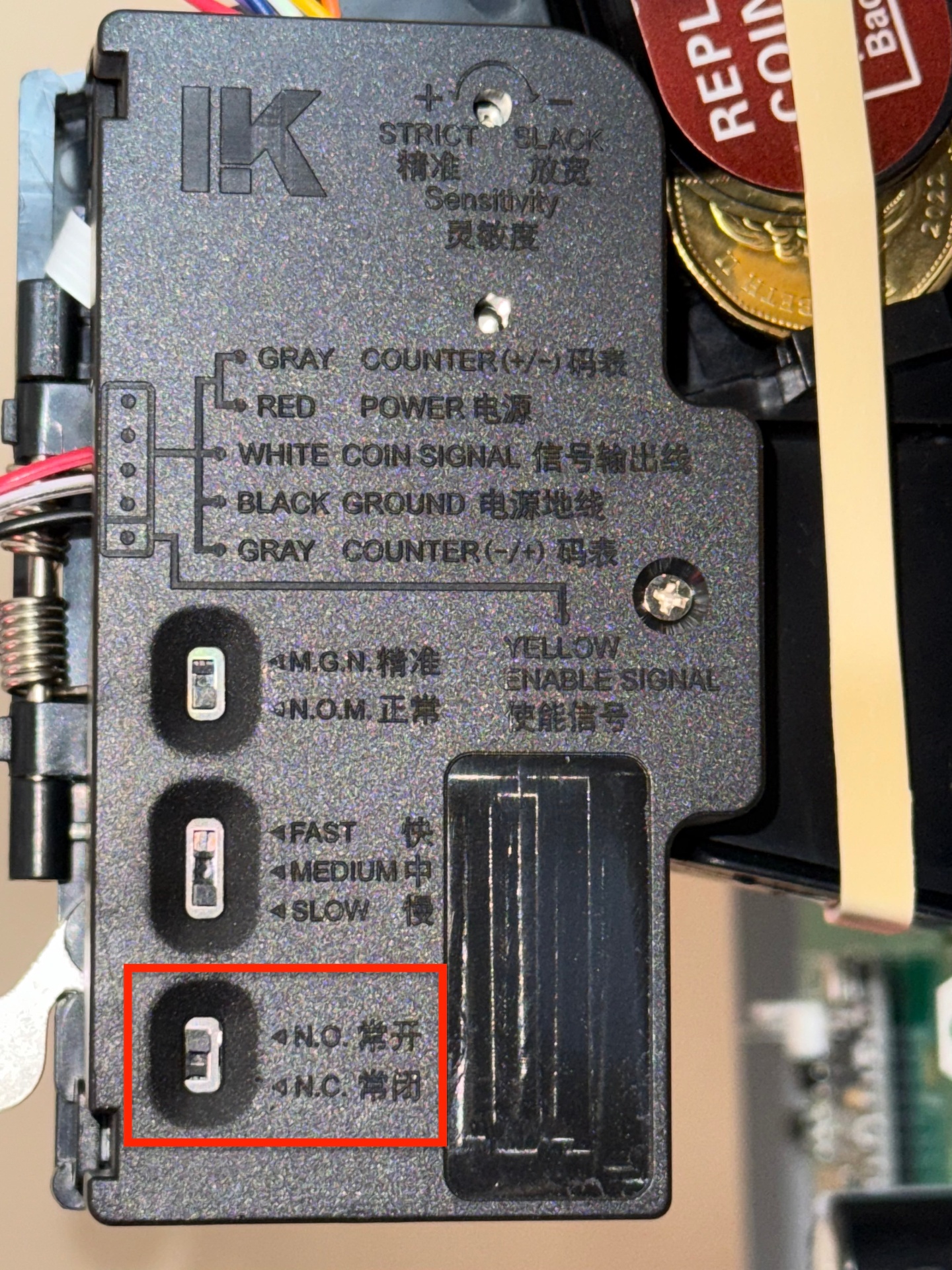 Dip switch board on coin acceptor