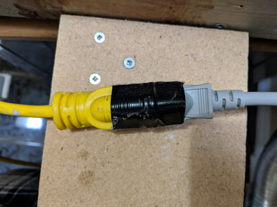 Final installation showing extension cord properly secured with electrical tape