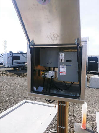 Interior view of custom enclosure showing coin box installation and protection
