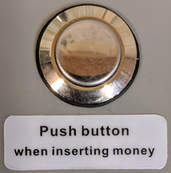 Push button that must be held when inserting money in tenant mode