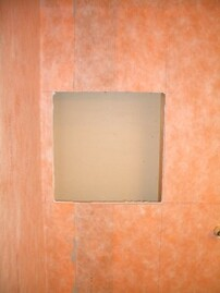 Recessed wall opening ready for converter box installation